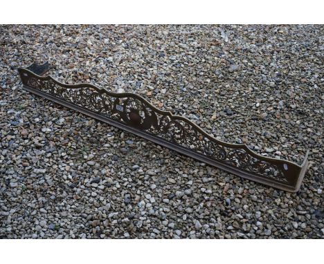 Brass Fire Fender, the pierced design including Birds / Phoenix surrounding a crest with scrolling foliage, 149cms long toget