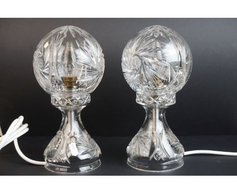 A pair of cut glass deco style lamps with wheel cut decoration. 