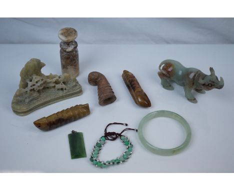 Selection of Six Chinese Stone Carved Items including Green Stone Rhino, 11cms long together with a Jade Bangle, Jade Pendant