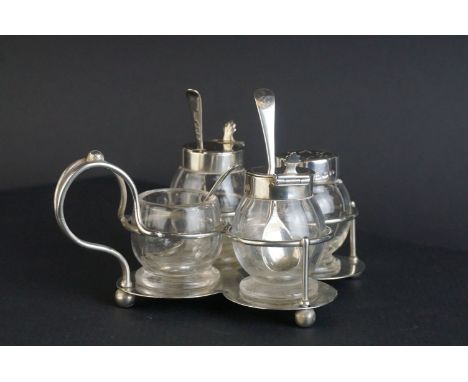 Victorian Silver Quatrefoil Cruet Stand holding Pair of Glass Mustards with Silver Lids and Spoons, a Glass Pepper with Silve