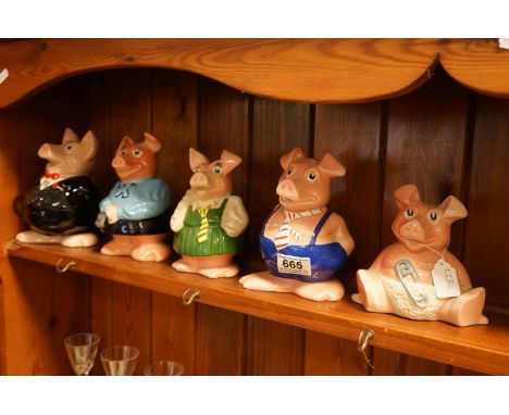 A set of five Wade Natwest piggy banks. 