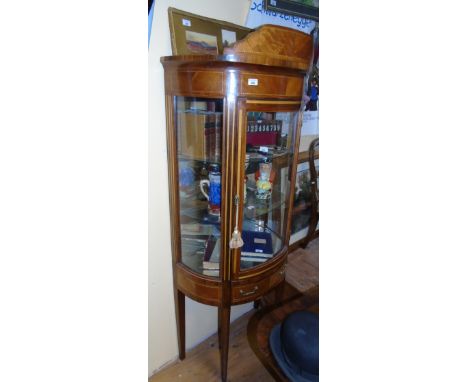 A Late 19th, Early 20th Century Walnut and String Inlayed Bow Fronted Display Cabinet.
