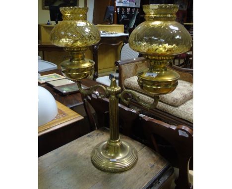 A Good 19th Century Brass Two Branch Oil Lamp with coloured base and glass shades.