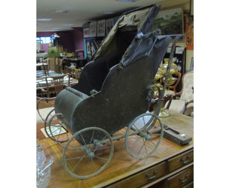 A 19th Century Cast and Timber Vintage Perambulator.