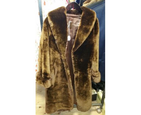 A Vintage Dark Brown Fur Coat, along with a vintage grey chinchilla fur coat.