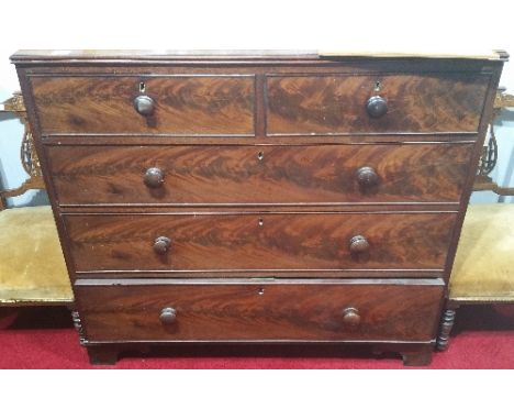 A Very Good Georgian Mahogany Chest of Drawers, having two short over three long drawers and standing on bracket feet.