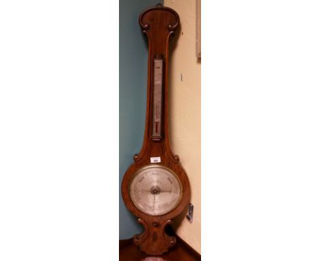 A 19th Century Rosewood Wheel Barometer with an engraved silvered dial and scale.