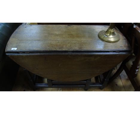 An 18th Century Oak Drop Leaf Gate Legged Table.