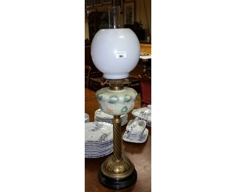 A Victorian Brass and Glass Oil Lamp with shade and globe.