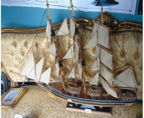 A Model Ship, a Rigged Model of the Cutty Sark. 32ins high x 27ins wide.