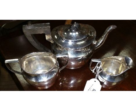 A George V Silver Three Piece Tea Service of Plain Outline. Birmingham: George Unite, 1920. 20.94 ozs.