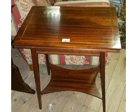 An Edwardian Mahogany and Inlaid Foldover Card Table.