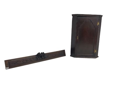 George III oak corner cupboard, single arch panelled door enclosing two shelves (W61cm H87cm); and carved oak panel with cent
