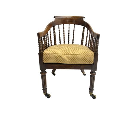 William IV rosewood tub armchair, the arched bow cresting rail over graduated bobbin turned spindles, cane seat with loose cu