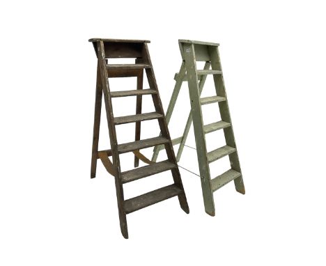 Early 20th century pine library or shop step ladder, seven tread (W45cm H135cm); together with another similar with painted l