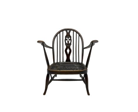 Ercol - tub armchair with pierced fleur-de-lis splatDimensions: Height:&nbsp;80cm&nbsp; Length/Width:&nbsp;70cm&nbsp;Conditio