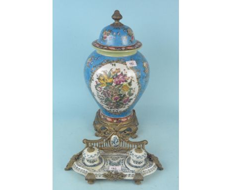 A large Oriental style lidded vase on metal bases, 49cm tall plus a blue and white ceramic double inkwell desk stand in metal