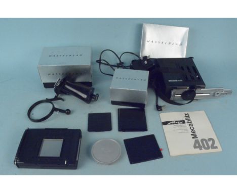 Assorted Hasselblad camera accessories, film magazine (A12), pistol grip for 500EL and magazine for Polaroid film together wi