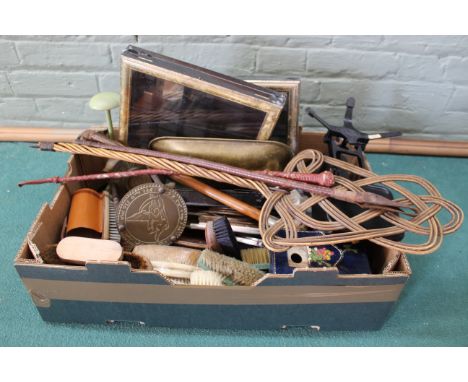 A mixed box of items including a set of scales, small display boxes, riding crops, metalware and brushes