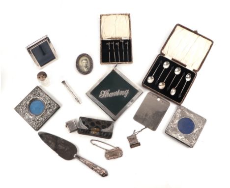 A quantity of assorted silver items to include a set of six coffee bean spoons, cased; a silver mounted shaving mirror; silve