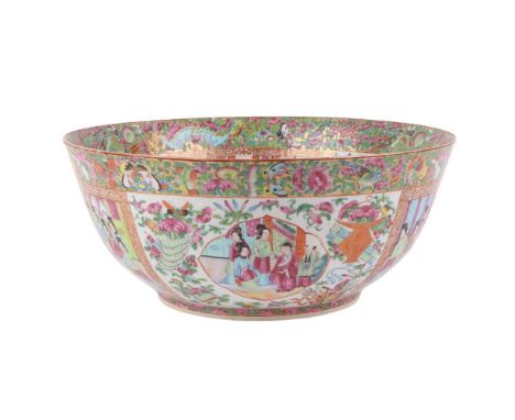 A large Chinese Canton Export famille rose punchbowl decorated with figures within panels with birds, butterflies and flowers