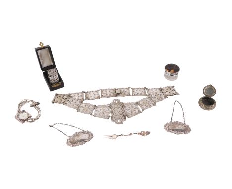 Two silver bottle labels; together with a silver topped dressing table jar; a Norwegian silver fork; a silver plated belt and