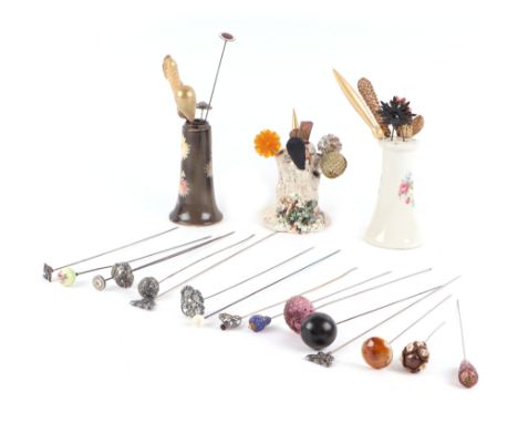 A large collection of hatpins to include silver and enamel examples.
