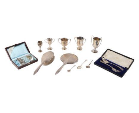 A silver twin-handled trophy cup with presentation inscription, 11cms high; together with four other trophy cups, various dat