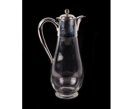 A Victorian style claret jug with silver plated mounts, 30cms high.