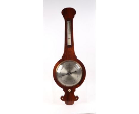 A wheel barometer with thermometer in a walnut case, 94cms high.