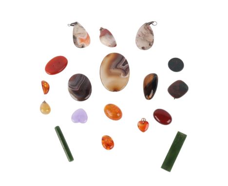 A group of eighteen pendants and loose semi precious stones to include agate, jade, amber and carnelian (18).