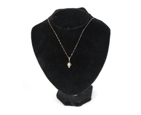 A 9ct gold opal pendant on a fine yellow metal chain, 1.4g.