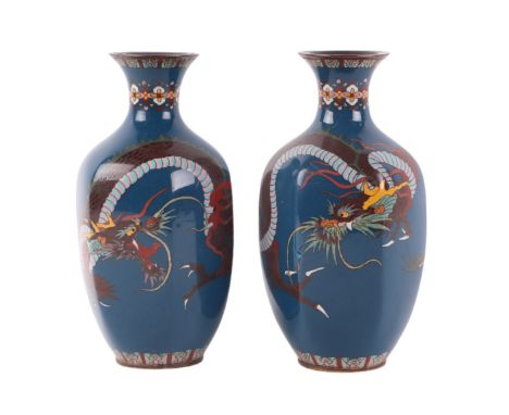 A pair of Japanese Meiji period cloisonné vases of hexagonal form decorated with dragons on a blue ground, 18cms high.Conditi