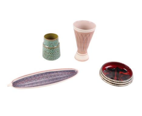 A 1950's Poole Pottery PRB pattern flared cylindrical vase, 20cms high; together with a cucumber dish, 32cms long; a Delphis 