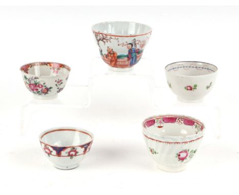 A group of Chinese famille rose ceramics to include tea bowls, tea cups and jug.