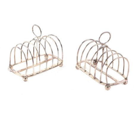 A pair of Victorian silver six-division toast racks, London 1886, each 11.5cms wide, marked 'FB' possibly Frederick Brasted, 