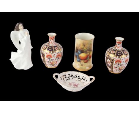 A Royal Worcester cylindrical vase of small proportion, decorated with a still life of fruit by R. Seabright, signed, 10cms h