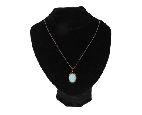 A 9ct gold mounted opal pendant on a fine 9ct gold chain, 4.8g.