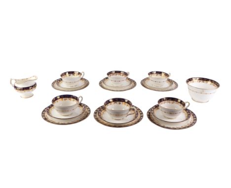 A Royal Worcester part tea service circa 1912, with blue and gilt decoration.