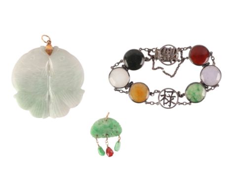 A green jade pendant with pink tourmaline drop; together with a yellow metal mounted double carved jade fish pendant and a si