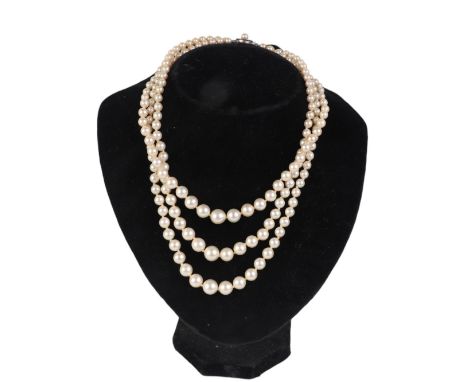 Three hand knotted cultured pearl necklaces, all with silver clasps (3).