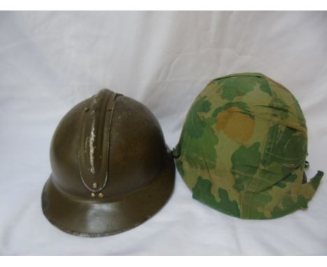 2 Vintage helmets 1 complete with liner