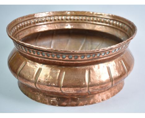 A Hand Beaten Oval Copper Planter, 35cms Wide and 16cms High