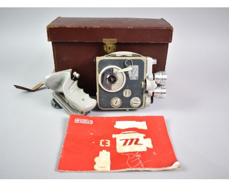 A Vintage Leather Cased Clockwork 8mm Cine Camera by Eumig, Model C3M, with Pistol Grip Handle and Instruction Manual