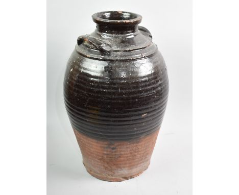 A Large Glazed Terracotta Wine Jar, Missing Tap, 46cms High