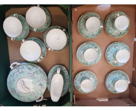 Royal Worcester Tea and dinner ware items in a pale green floral avian pattern to include 6 trios, lidded tureen, 6 soup coup