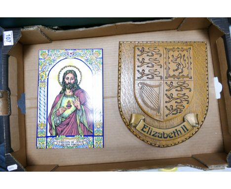 One wooden coat-of-arms wall hanging "Queen Elizabeth II" together with one Spanish tile depiciting the Sacred Heart "Corazon