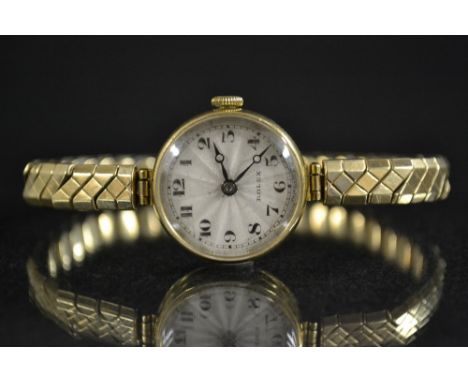 Rolex - a vintage ladys bracelet watch, silver sunburst dial, Arabic numerals, minute track, blued hands, manual 15 jewel Rol