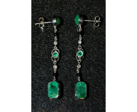 A pair of emerald green and multi-colour stone droplet earrings, each with an emerald green cabochon stud suspending a shaped