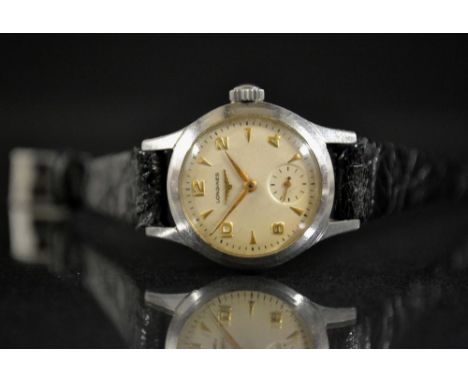 Longines - a 1950s lady's stainless steel cased wristwatch, cream dial, alternating Arabic numerals and Arrow batons, minute 